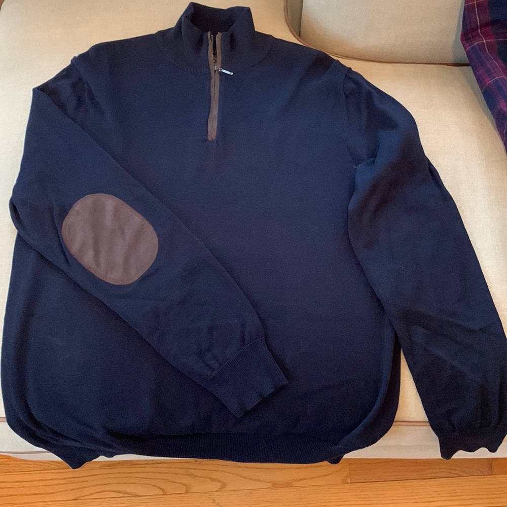 Navy 1/2 zip, brown suede-like trim, tags off, not worn. Cotton, washable.